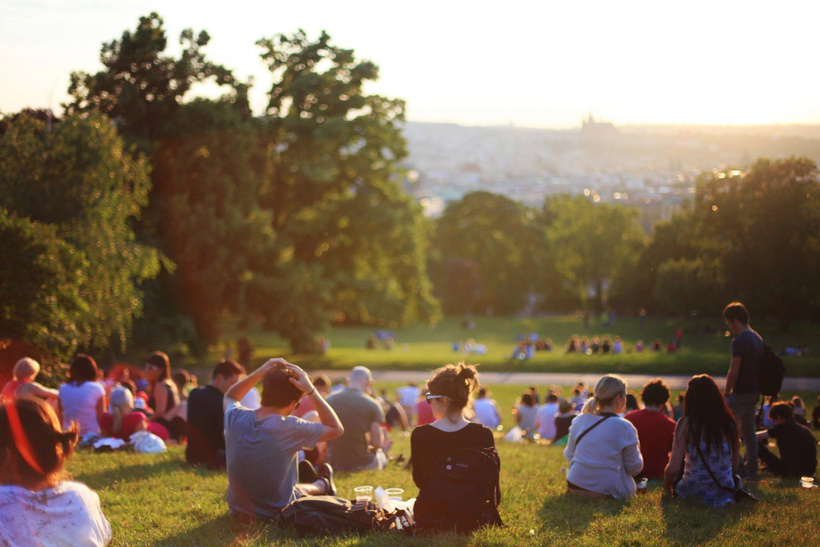 Friends sitting together outdoors
